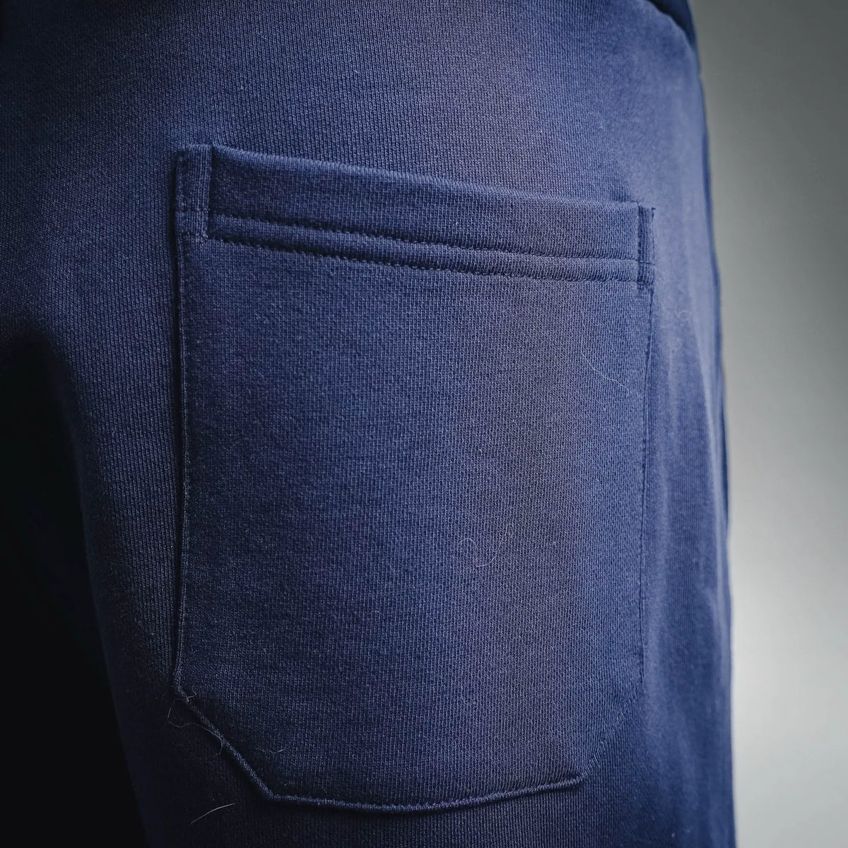 Navy Dior shorts front welt pocket with clean topstitching