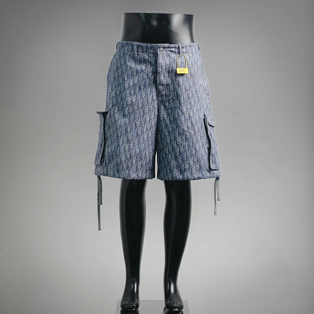 Blue Dior monogram denim shorts with cargo pockets and hanging ties