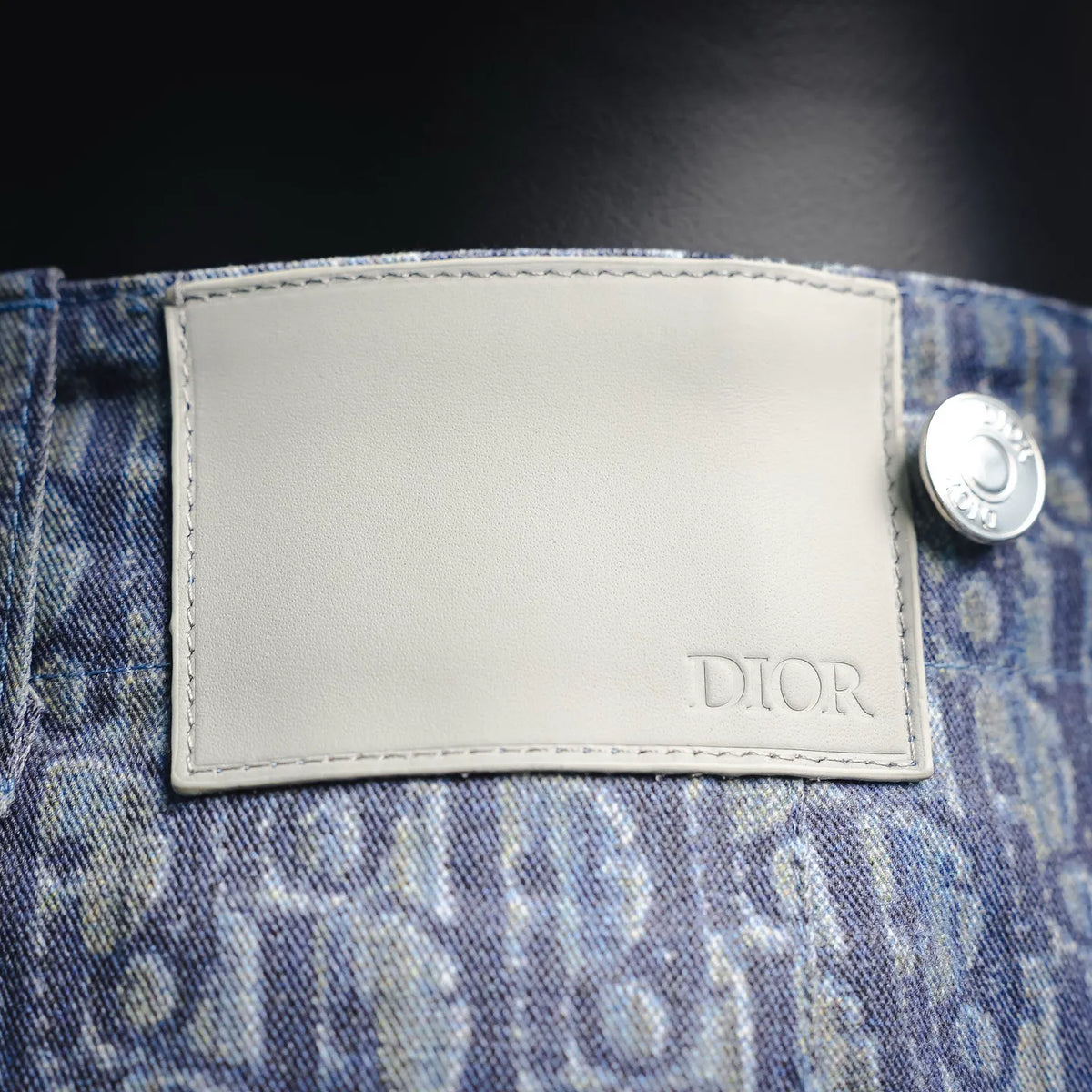 Dior embossed leather patch on blue monogram denim waistband