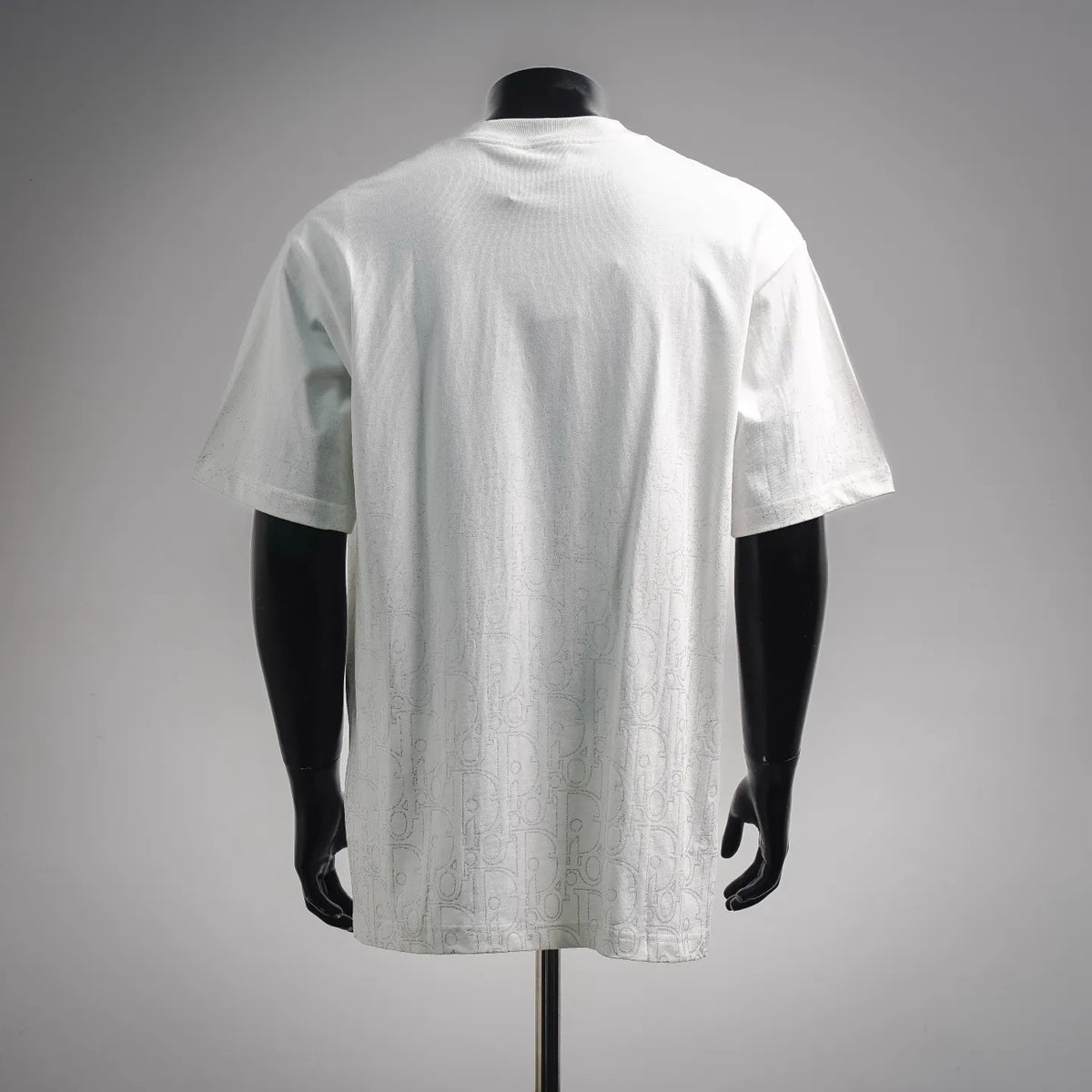 Dior white short-sleeve T-shirt back view on a mannequin, textured pattern