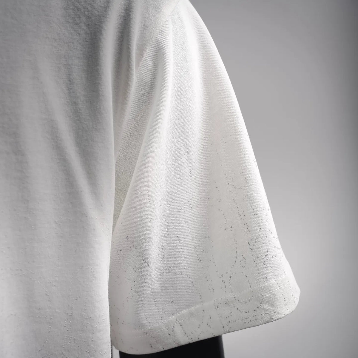 Dior white short-sleeve T-shirt side view, relaxed drape and straight hem