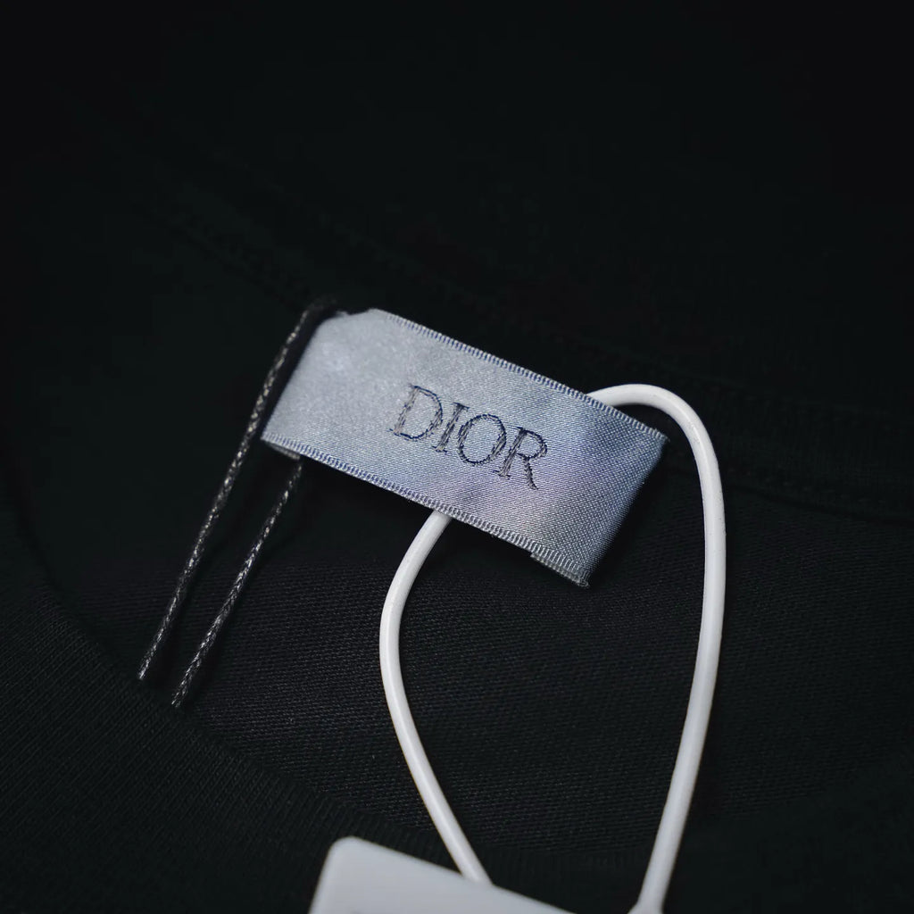 Dior T-shirt neck label close-up with white drawstring detail