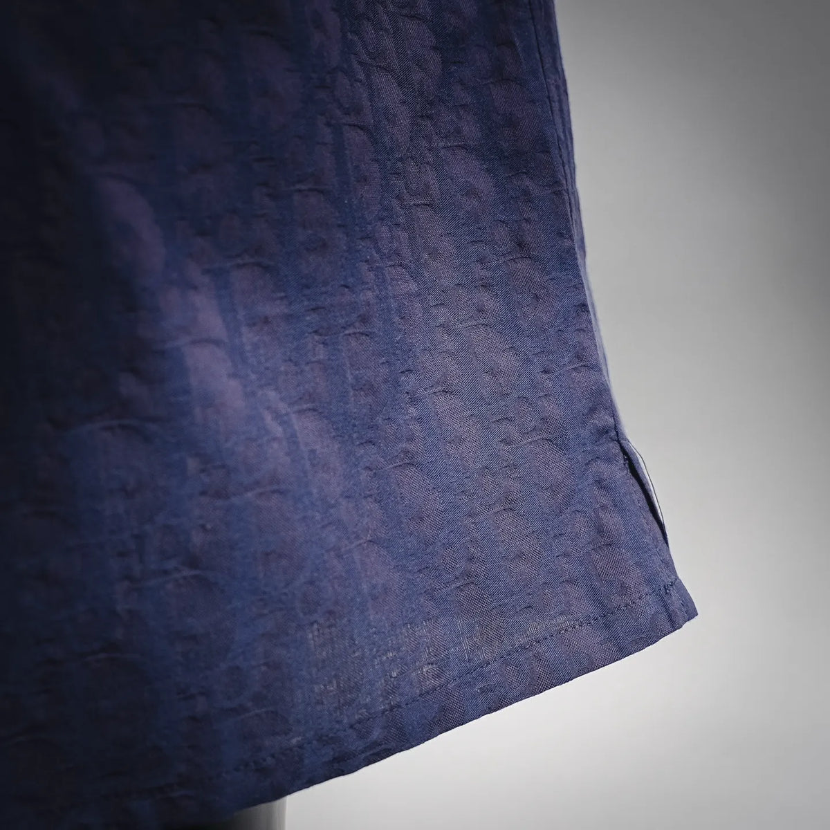 Navy shorts with straight hem and subtle textured fabric finish
