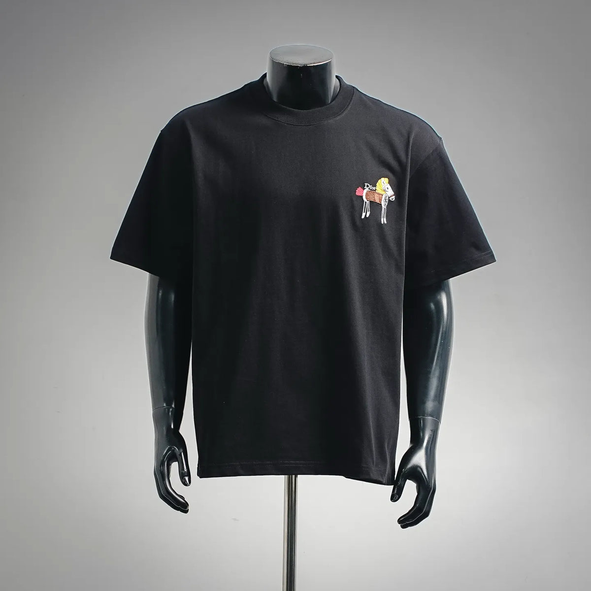 Black crew-neck T-shirt with small colorful chest graphic embroidery on front