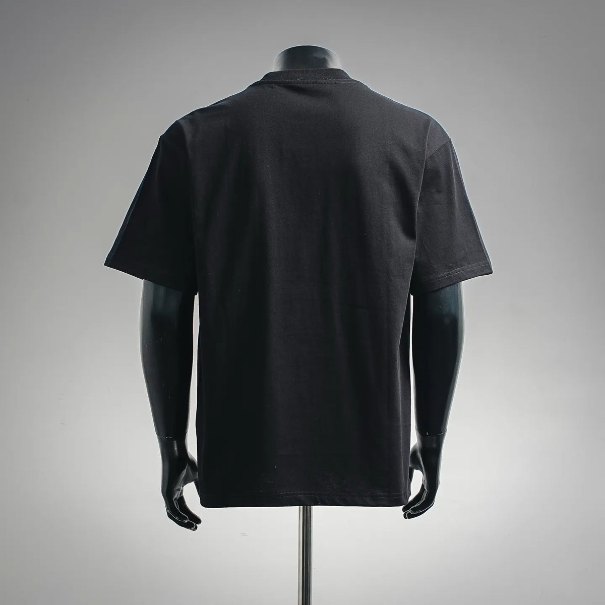 Black crew-neck T-shirt, back view on a mannequin