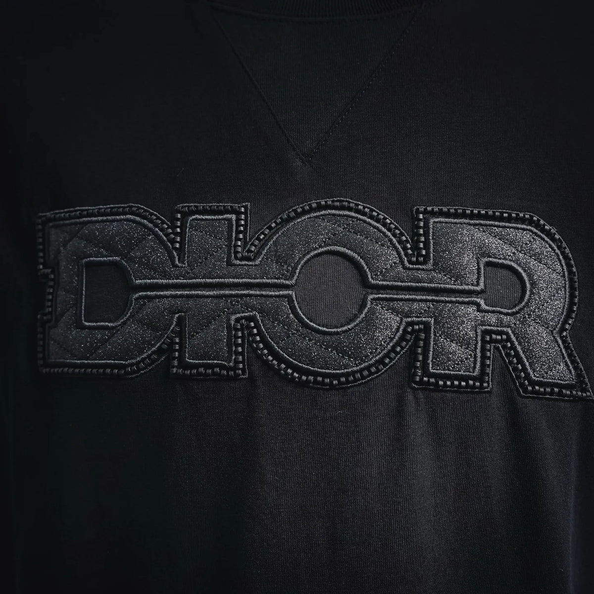 Dior T-shirt chest logo graphic in embossed-style print, dark fabric