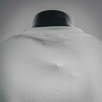 White Dior logo T-shirt upper back close-up, smooth fabric and collar