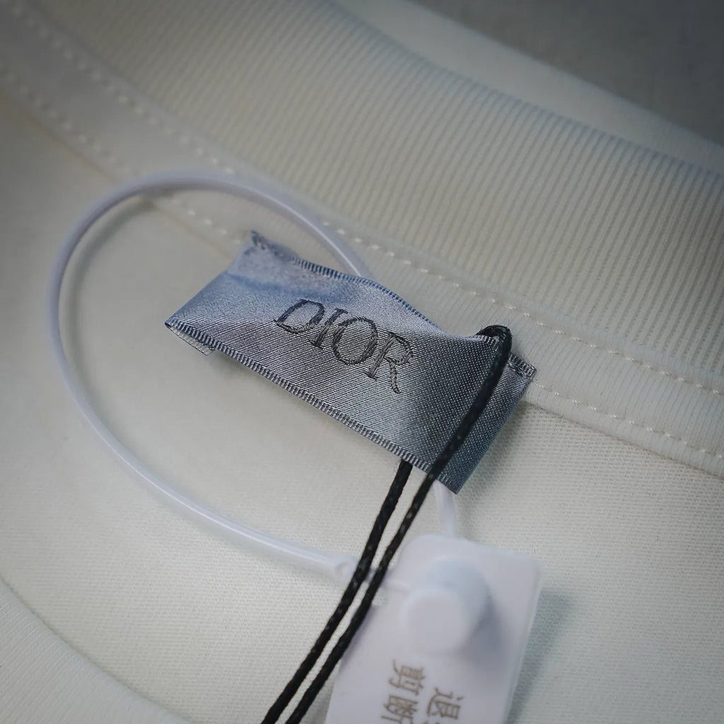 White Dior logo T-shirt interior neck label with brand tag and stitching