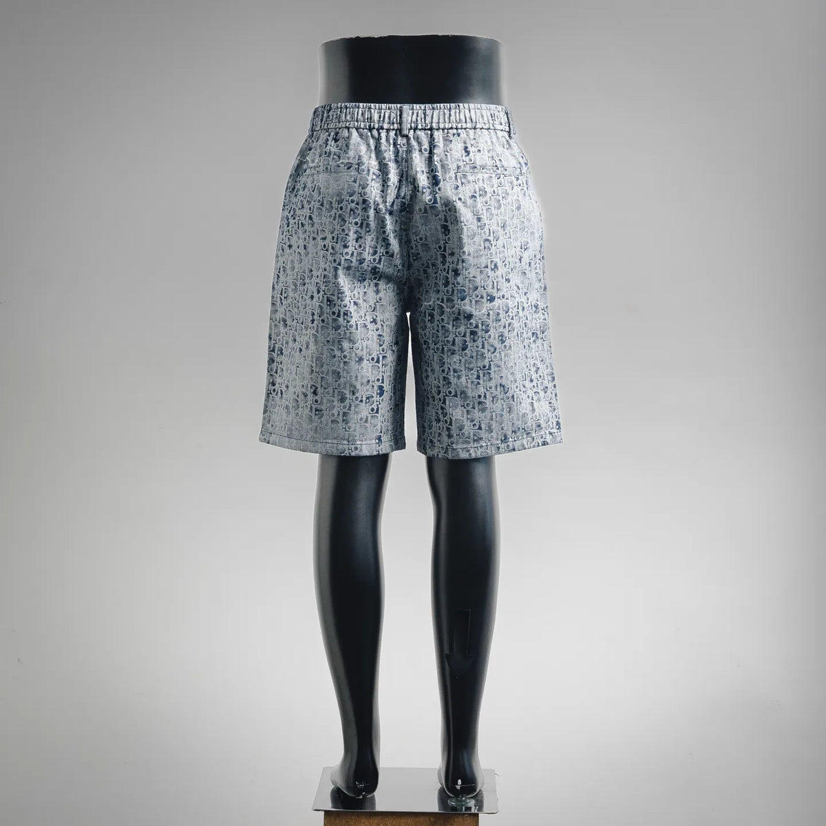 Dior blue patterned shorts from side view, elastic waistband