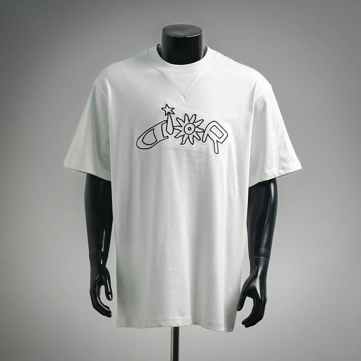 White short-sleeve T-shirt with black outline graphic and crew neck on a mannequin