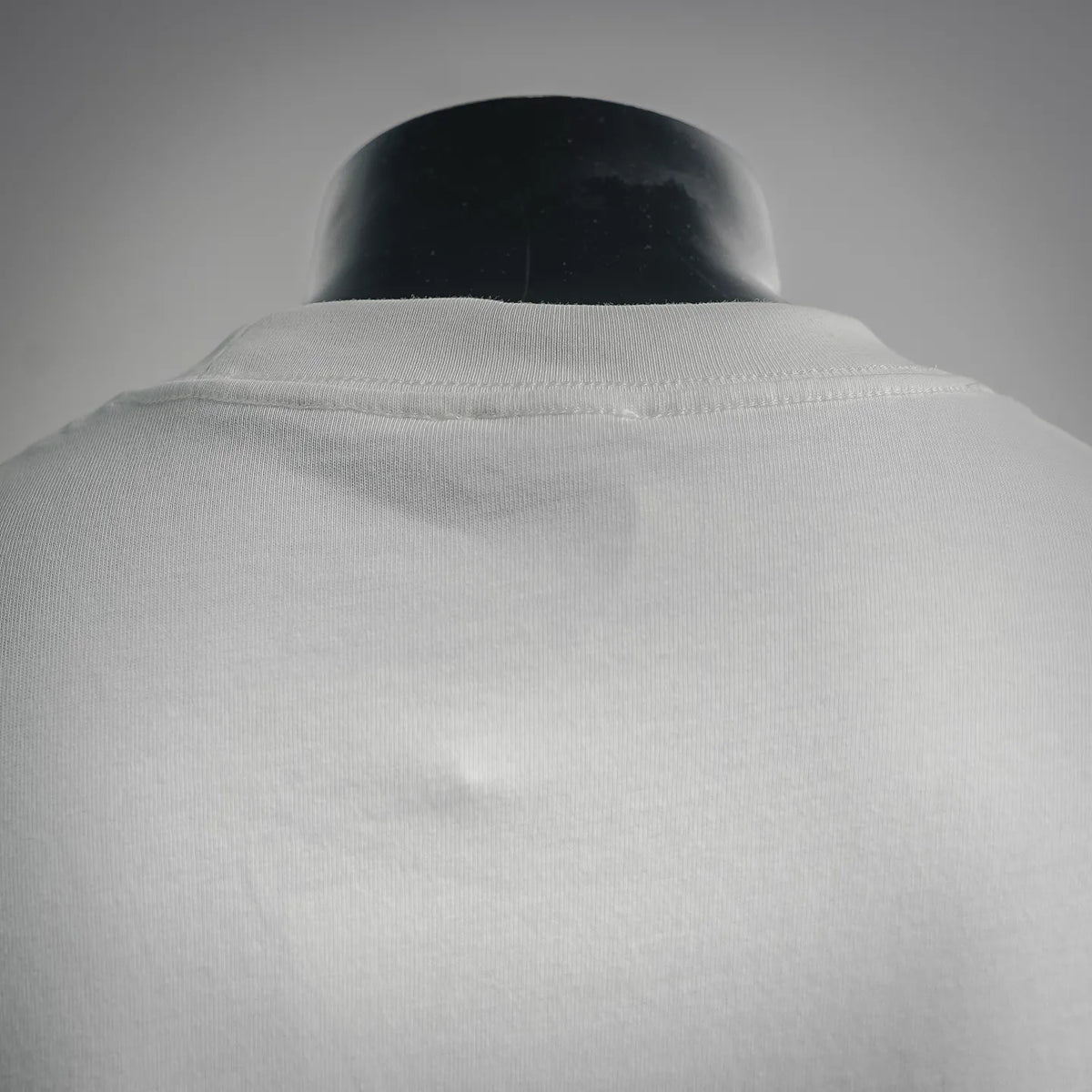 White T-shirt collar and upper back on mannequin