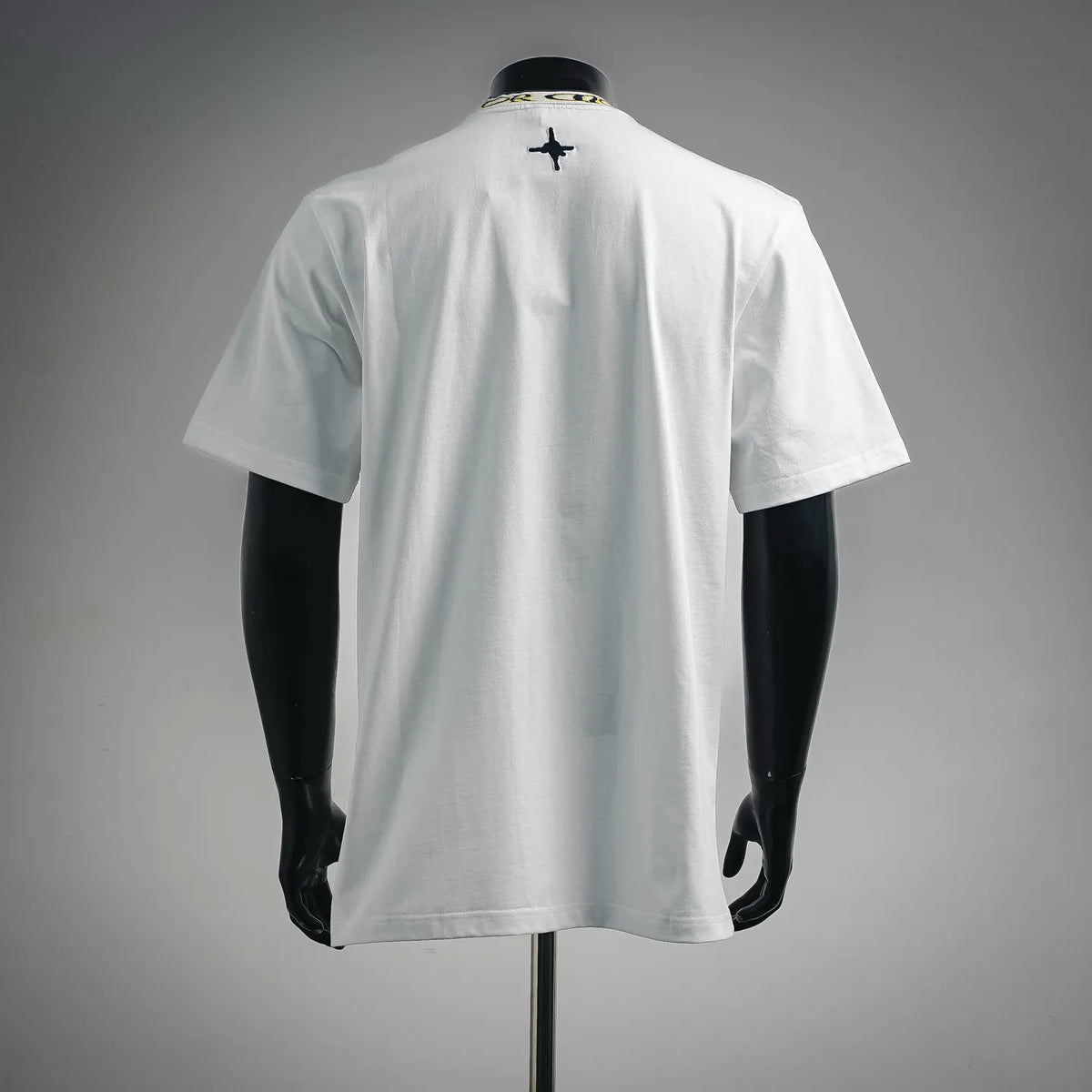 White short-sleeve T-shirt back with small navy star graphic near upper center