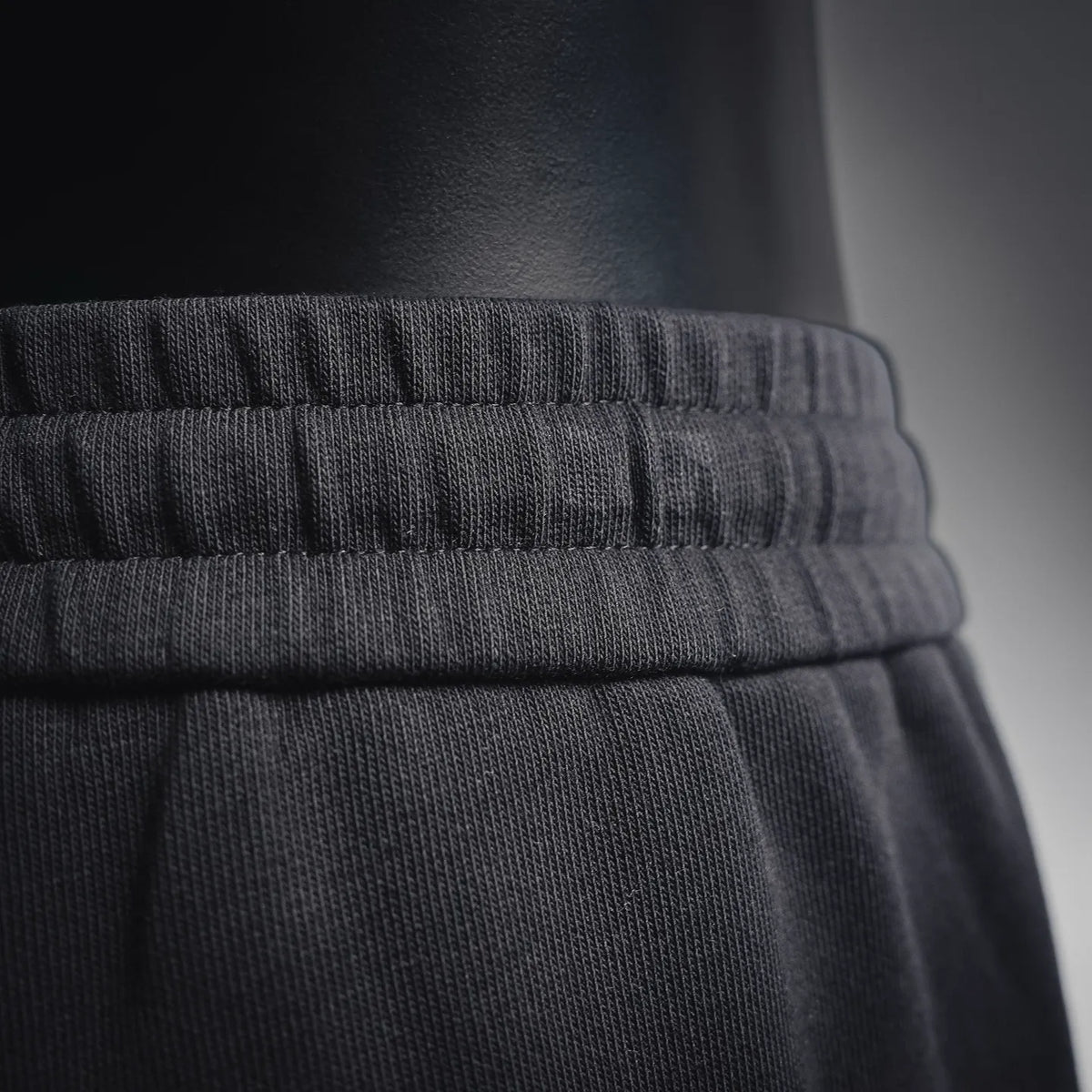 Dior black shorts hem with ribbed waistband and smooth fabric texture