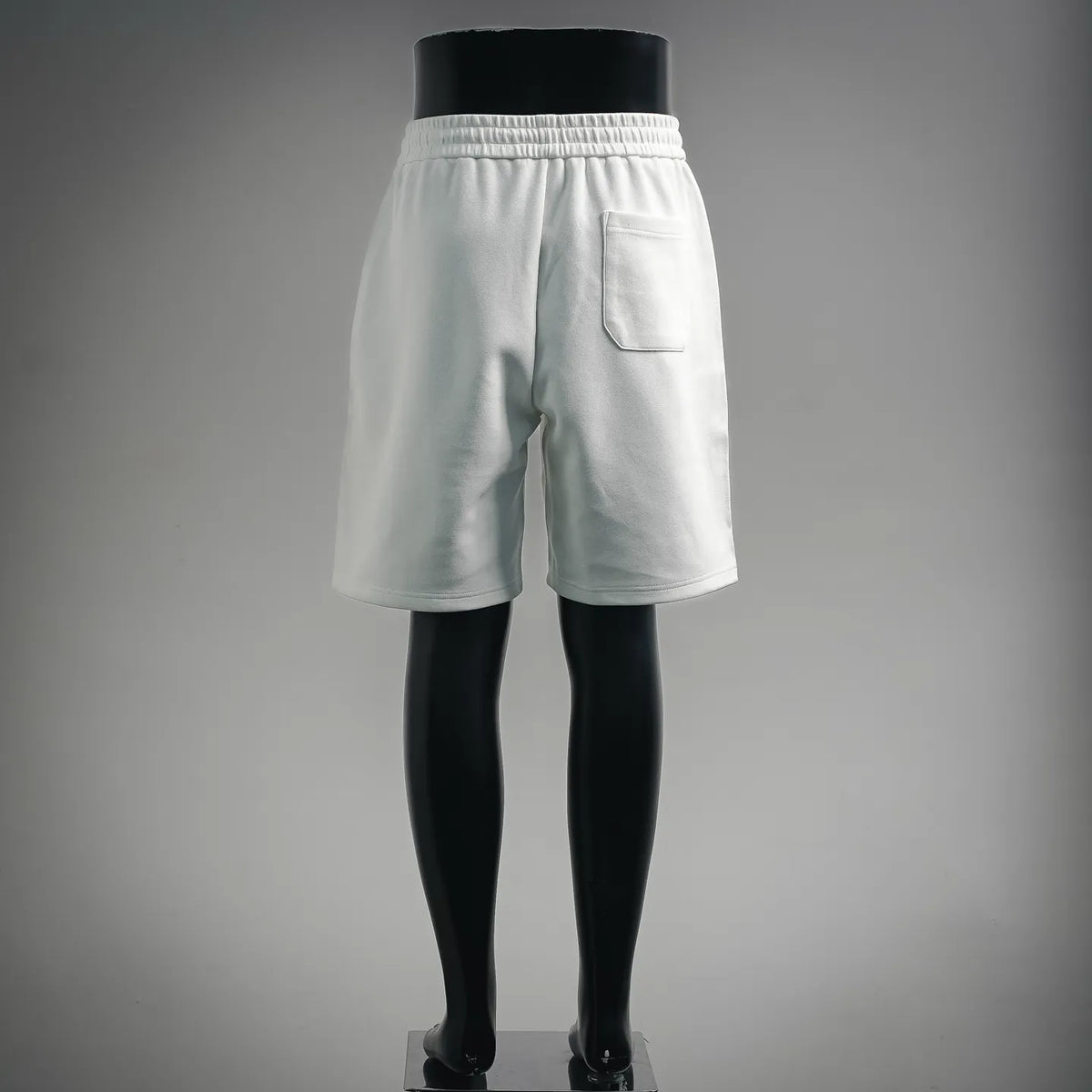 White shorts with elastic waistband and back pocket detail