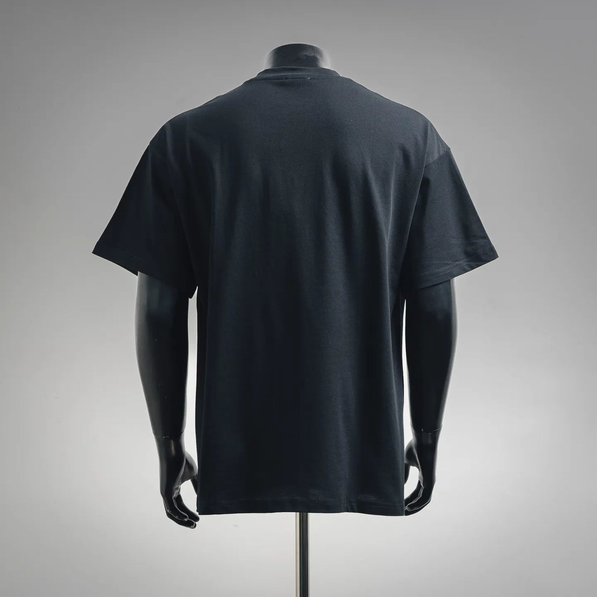 Dior short-sleeve T-shirt on a mannequin, back view, plain dark fabric