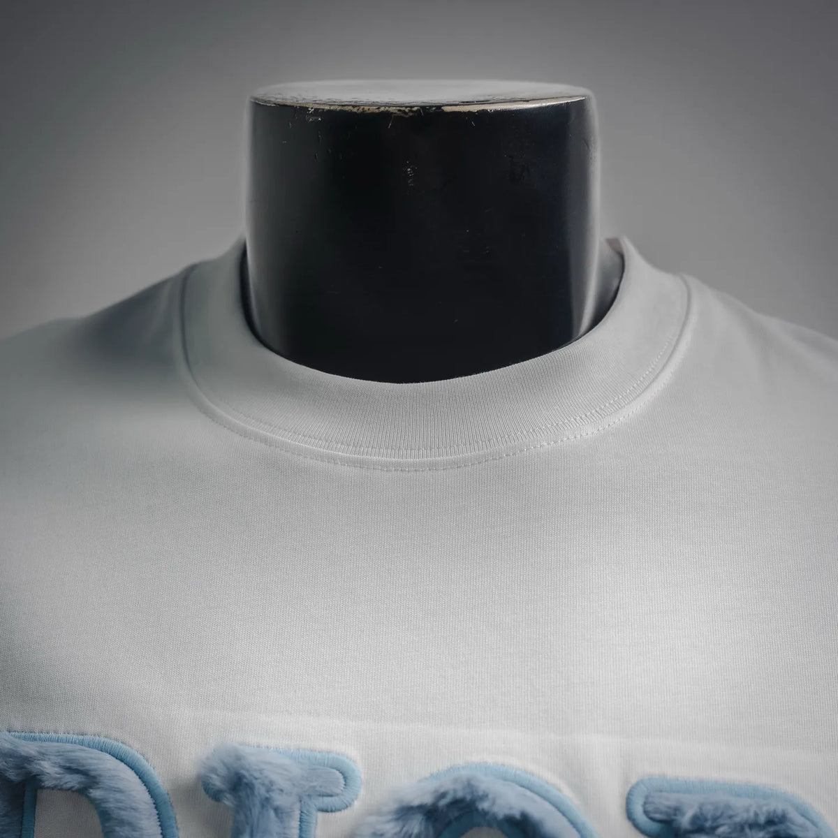 White Dior logo T-shirt neck and upper chest view with crew collar