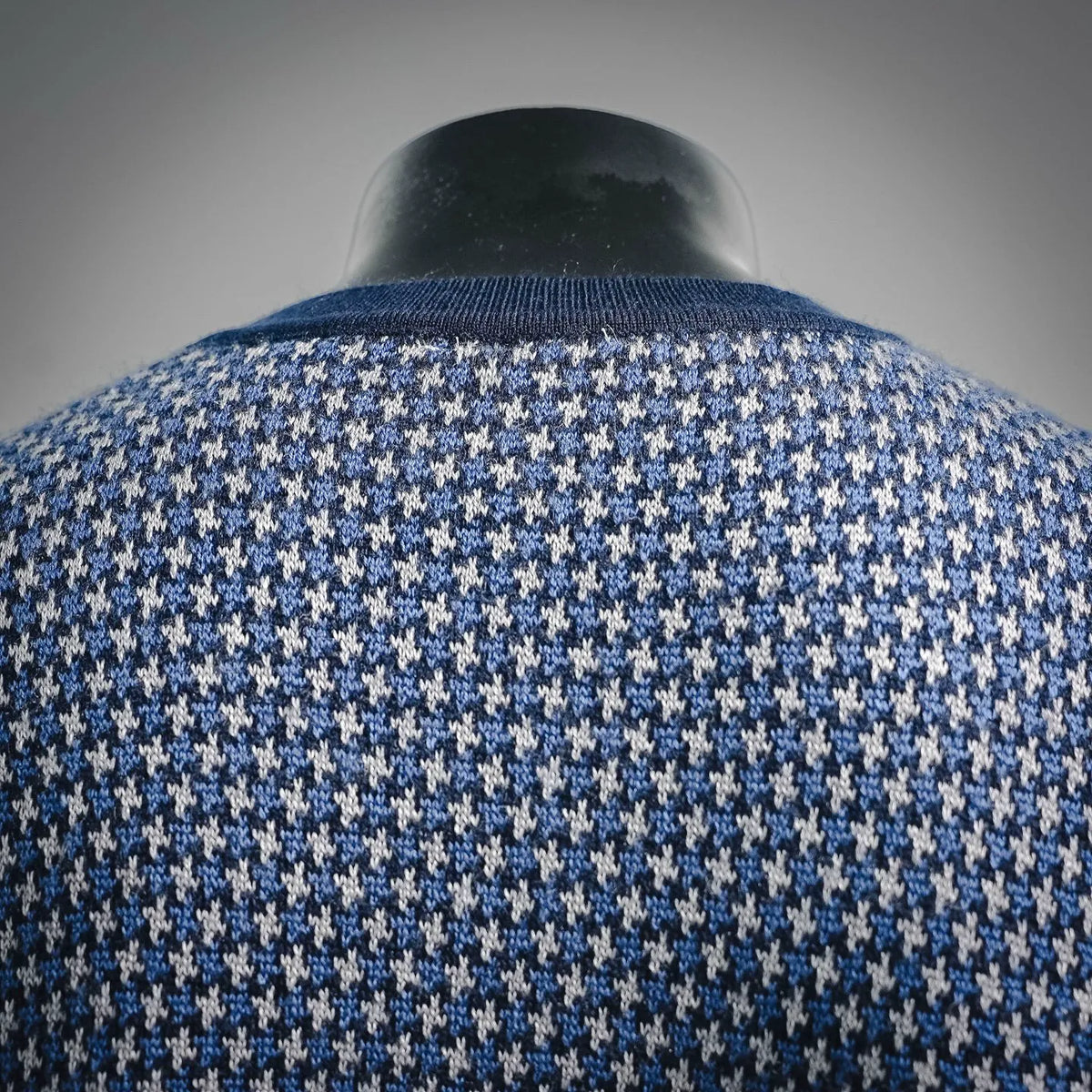 Crewneck sweater back yoke detail in blue and white houndstooth knit