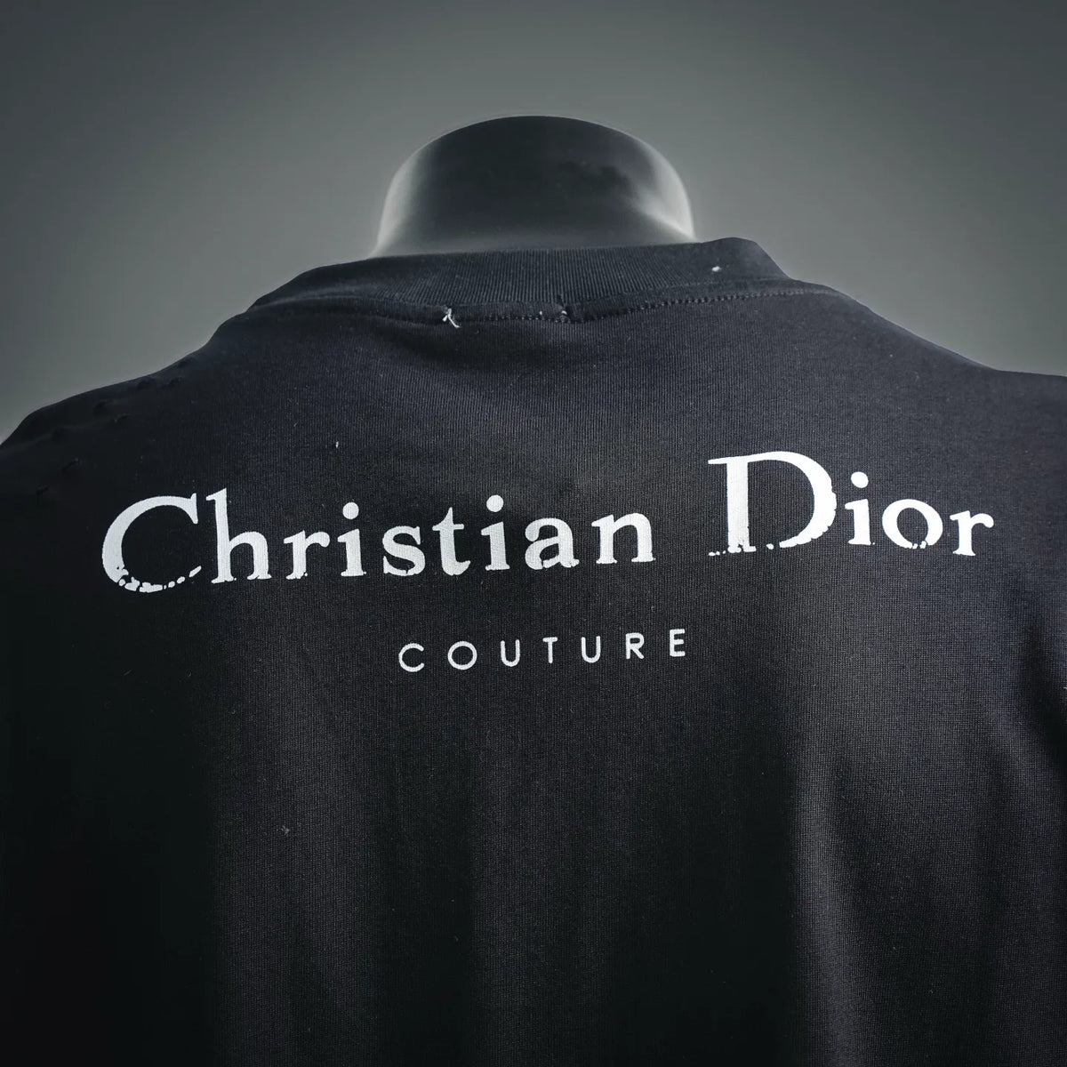 Black Dior T-shirt close-up of large back logo and “Couture”