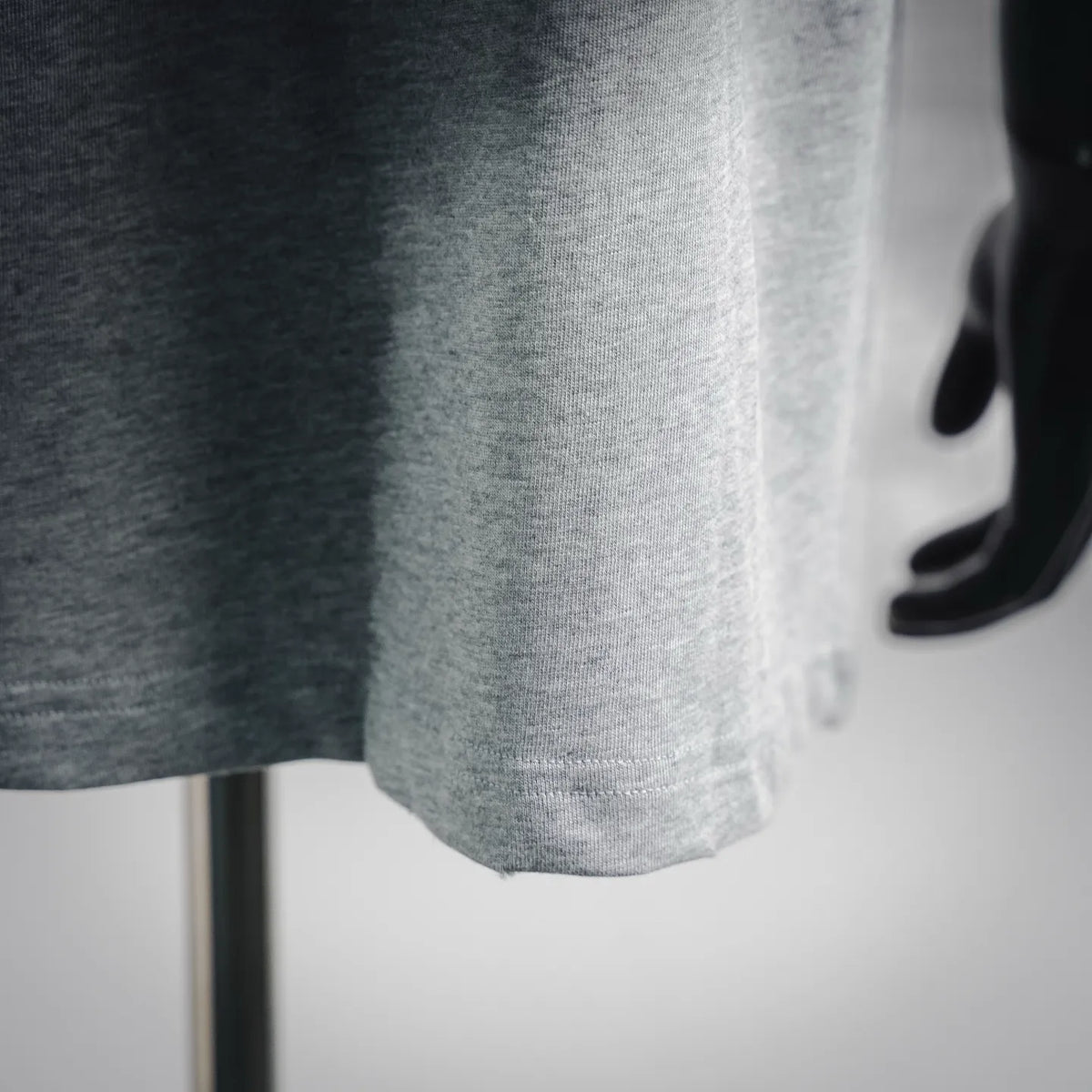 Light gray short-sleeve T-shirt hem and ribbed neckline detail