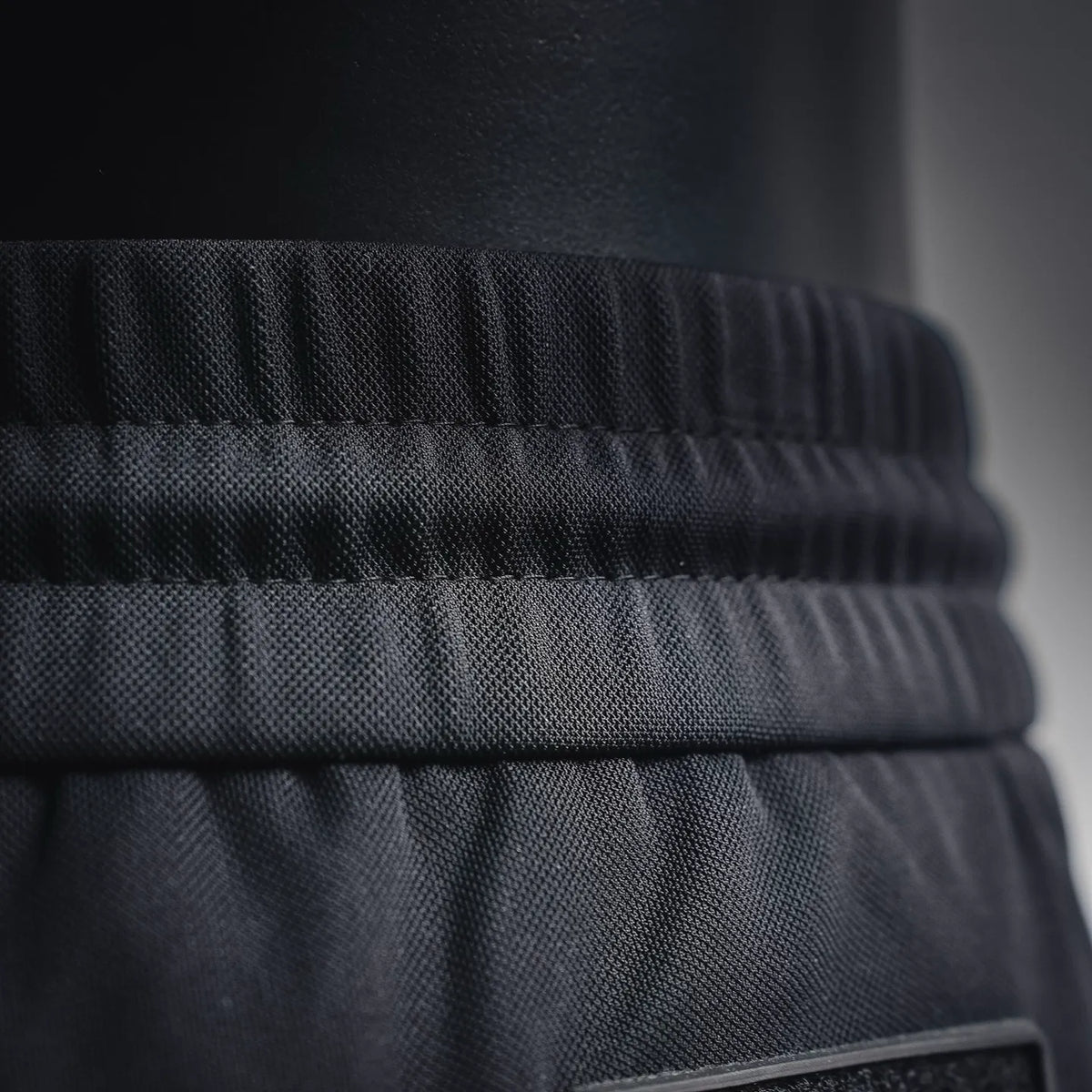 Dior black elastic waistband close-up with textured fabric