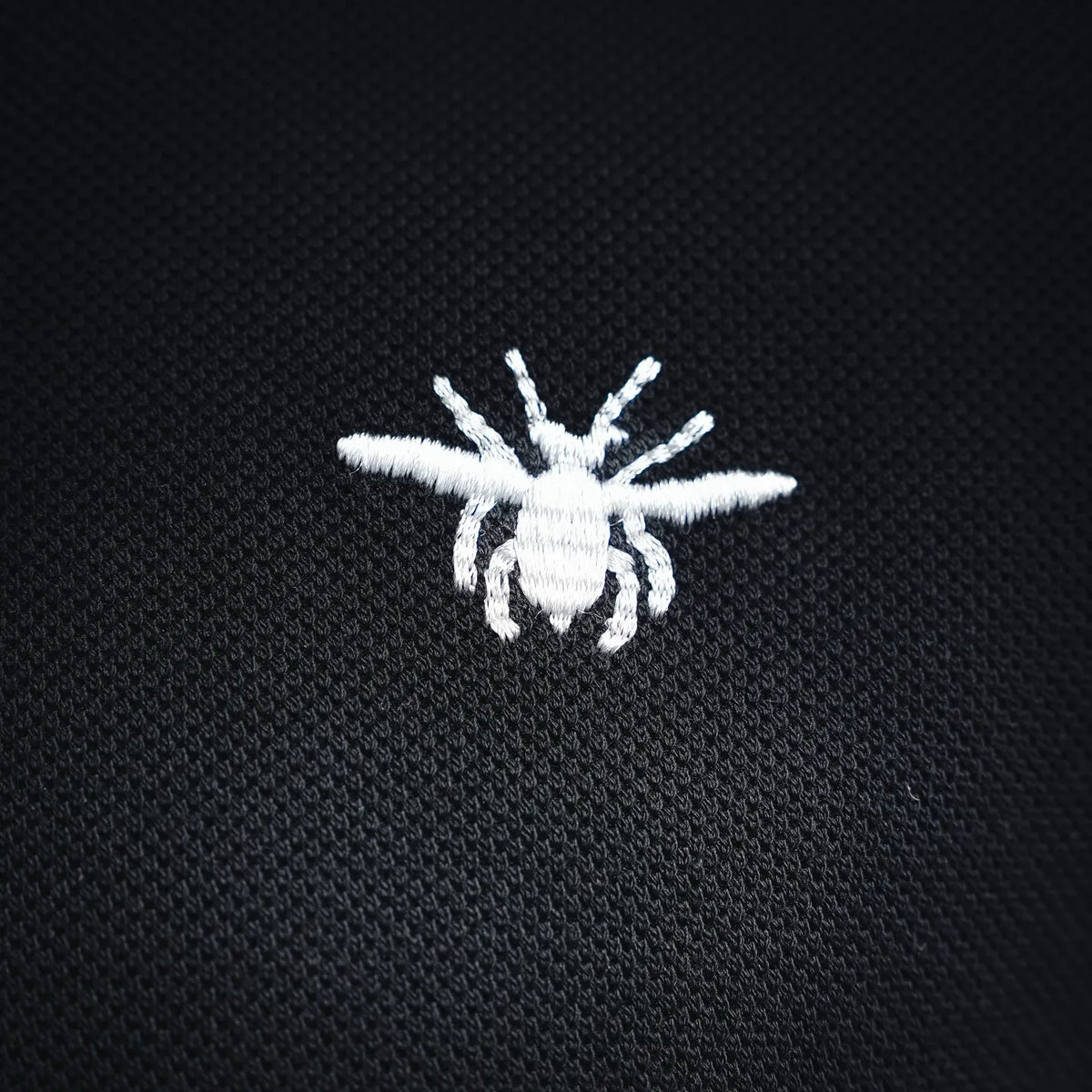 Dior dark polo shirt chest logo embroidery in white on textured fabric
