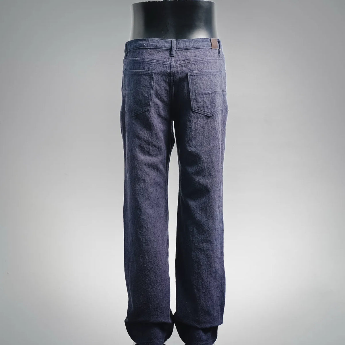 Dark blue Dior denim pants, back view with stitched waistband