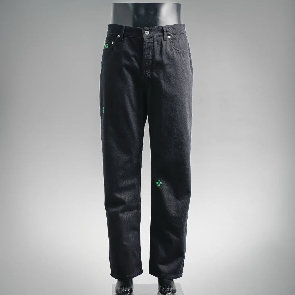 Black pants with green clover embroidery, button waist and front pockets