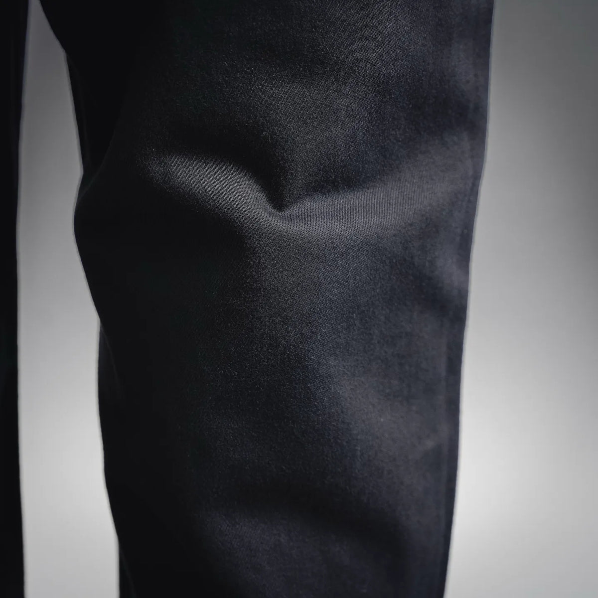 Close-up of dark fabric texture on black pants