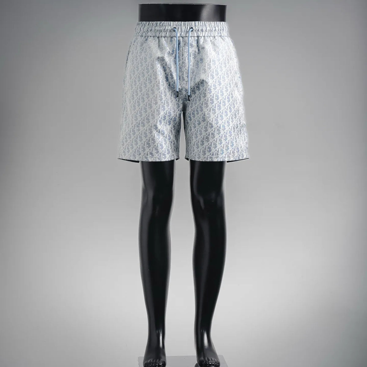 Light blue Dior patterned shorts with elastic waist and drawstring