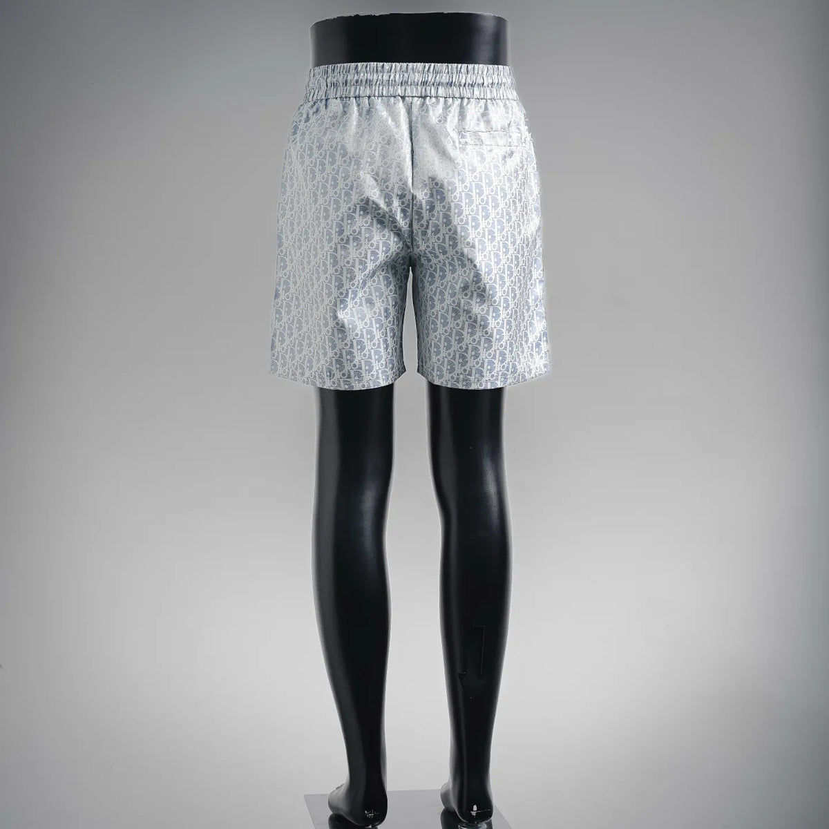 Light blue patterned shorts with elastic waistband and adjustable drawstring