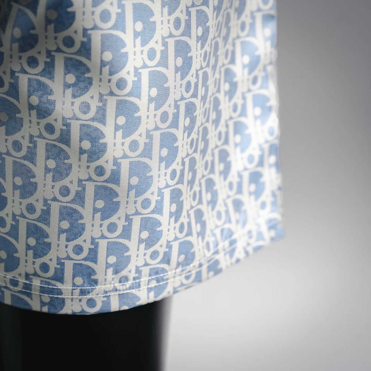 Close-up of light blue and white patterned fabric on shorts