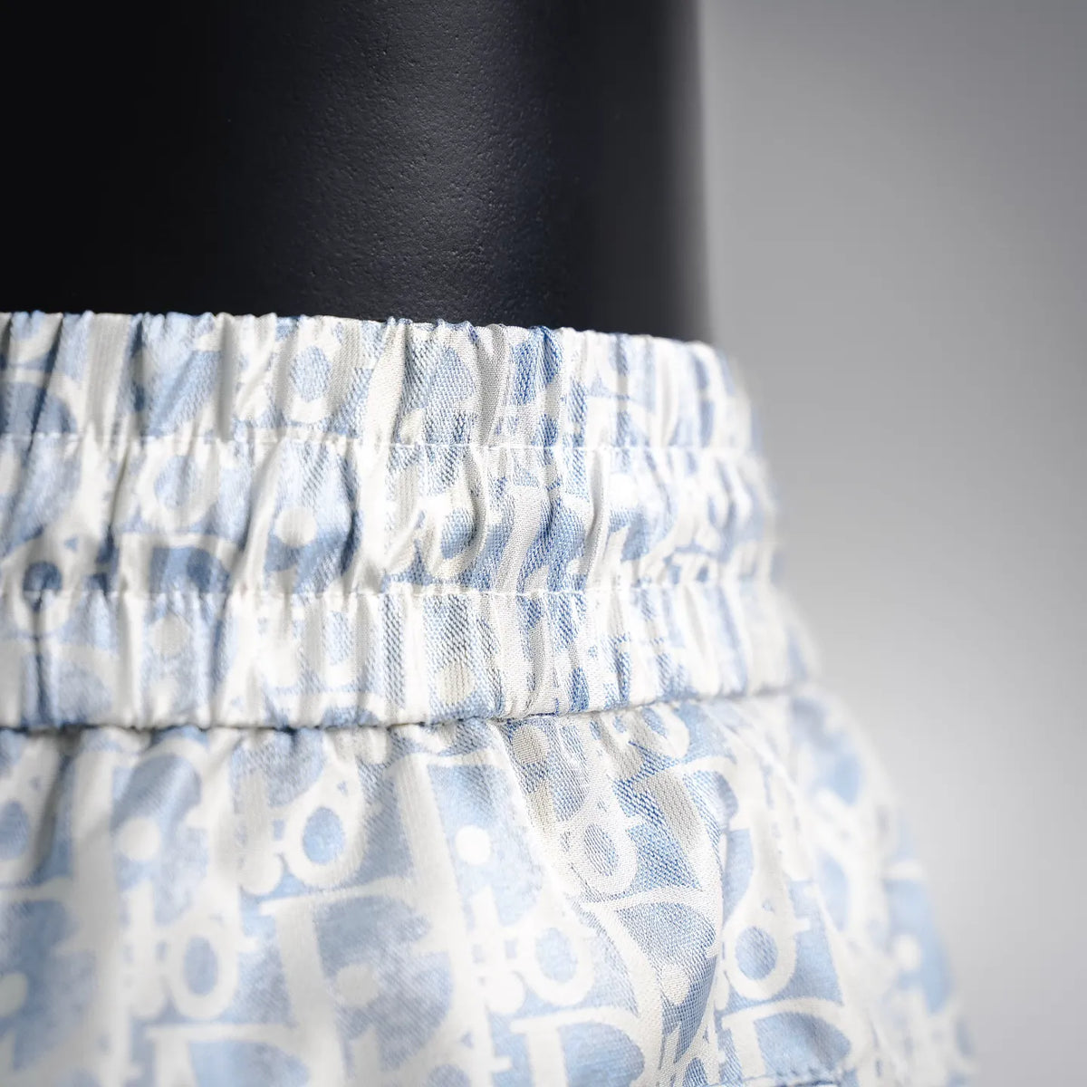 Elastic waistband detail on light blue patterned shorts