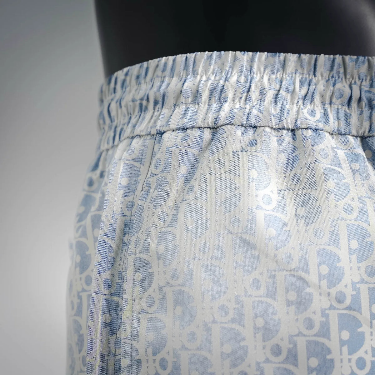 Light blue patterned drawstring shorts with elastic waist and side seam