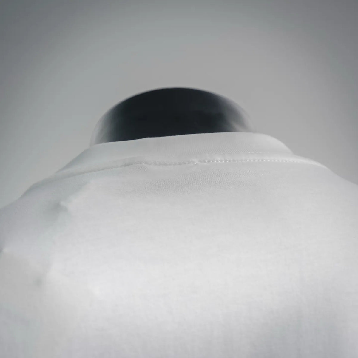 White t-shirt neckline and back seam detail on mannequin