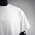 White short-sleeve t-shirt with small embossed Dior logo on chest