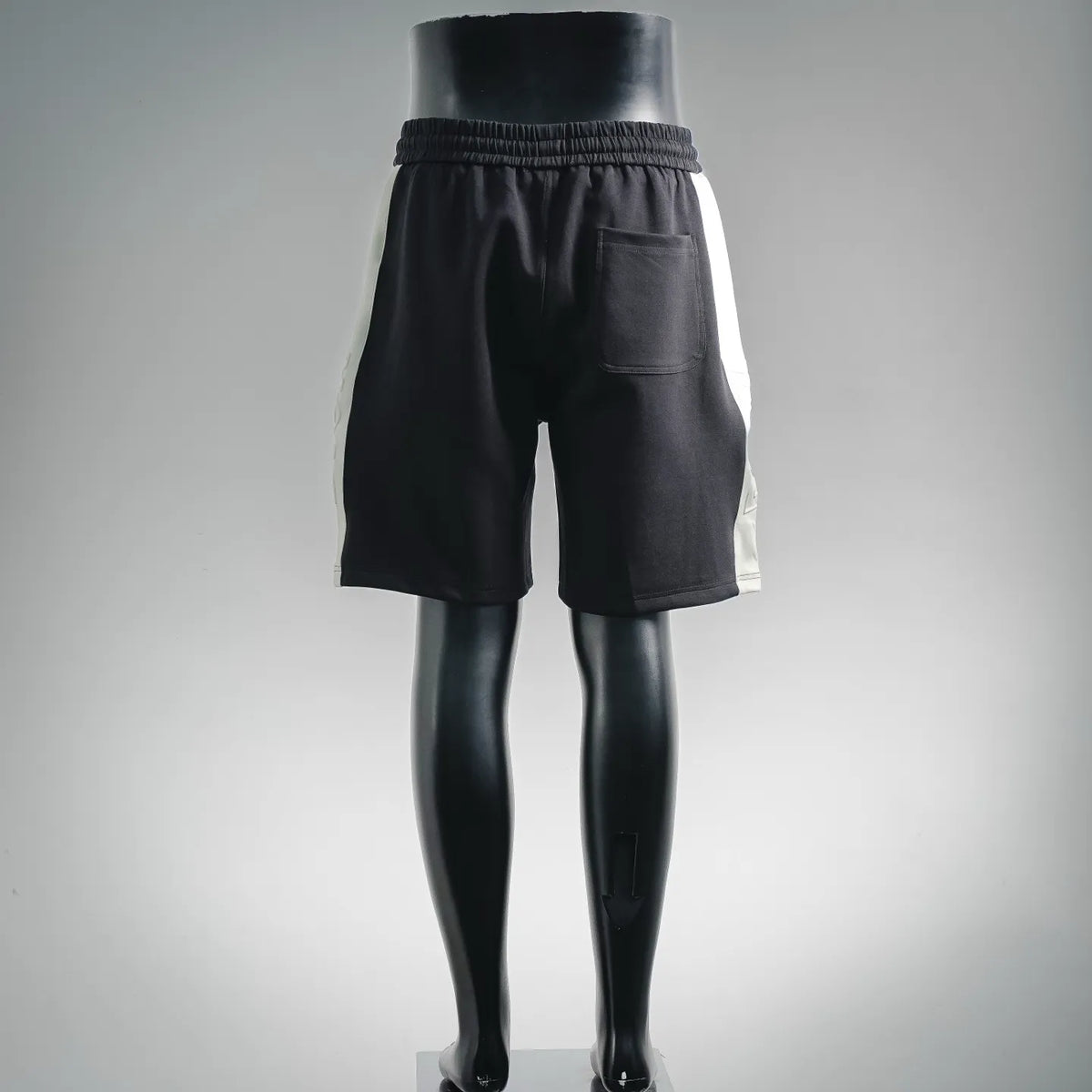 Black drawstring waist shorts with side pockets and relaxed straight legs