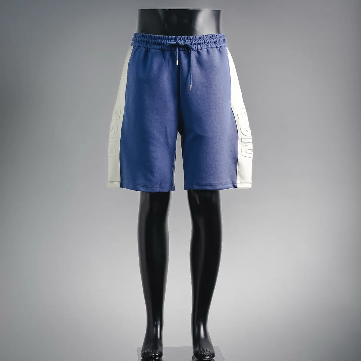 Dior blue track shorts, elastic waistband, drawstring and white side panels