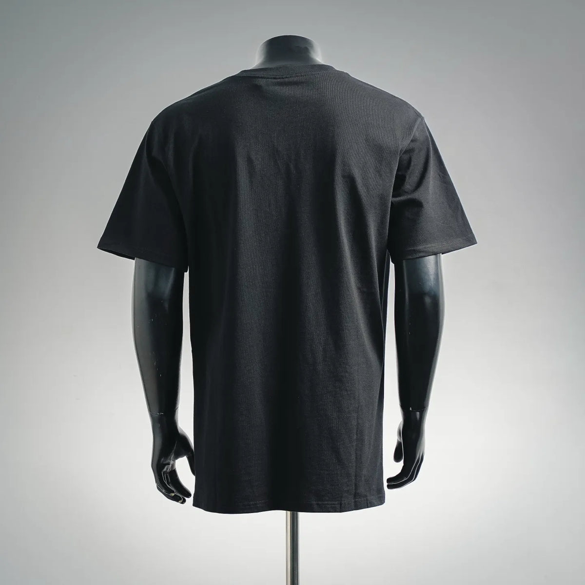 Black crewneck T-shirt on mannequin, back view with short sleeves and relaxed fit
