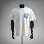 White short-sleeve T-shirt with blue abstract Dior logo graphic