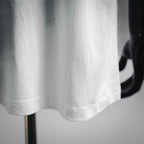 White short-sleeve T-shirt hem with visible stitching