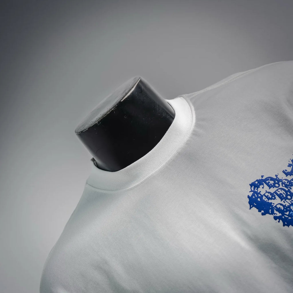 White crew-neck T-shirt with blue graphic detail at chest