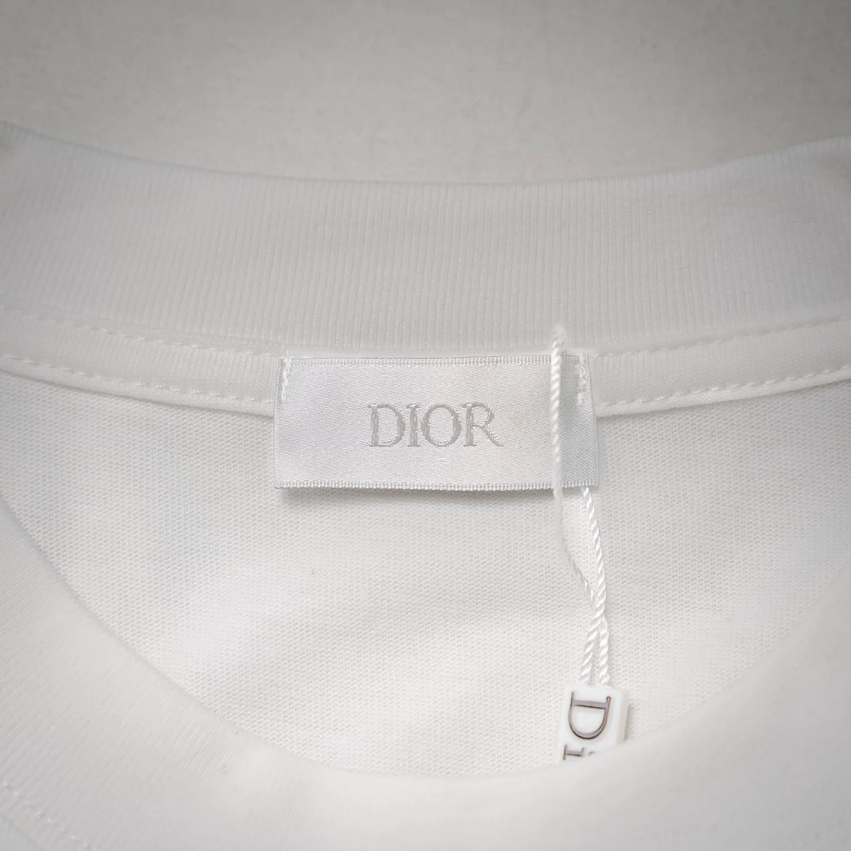 Dior size label inside white T-shirt neckline