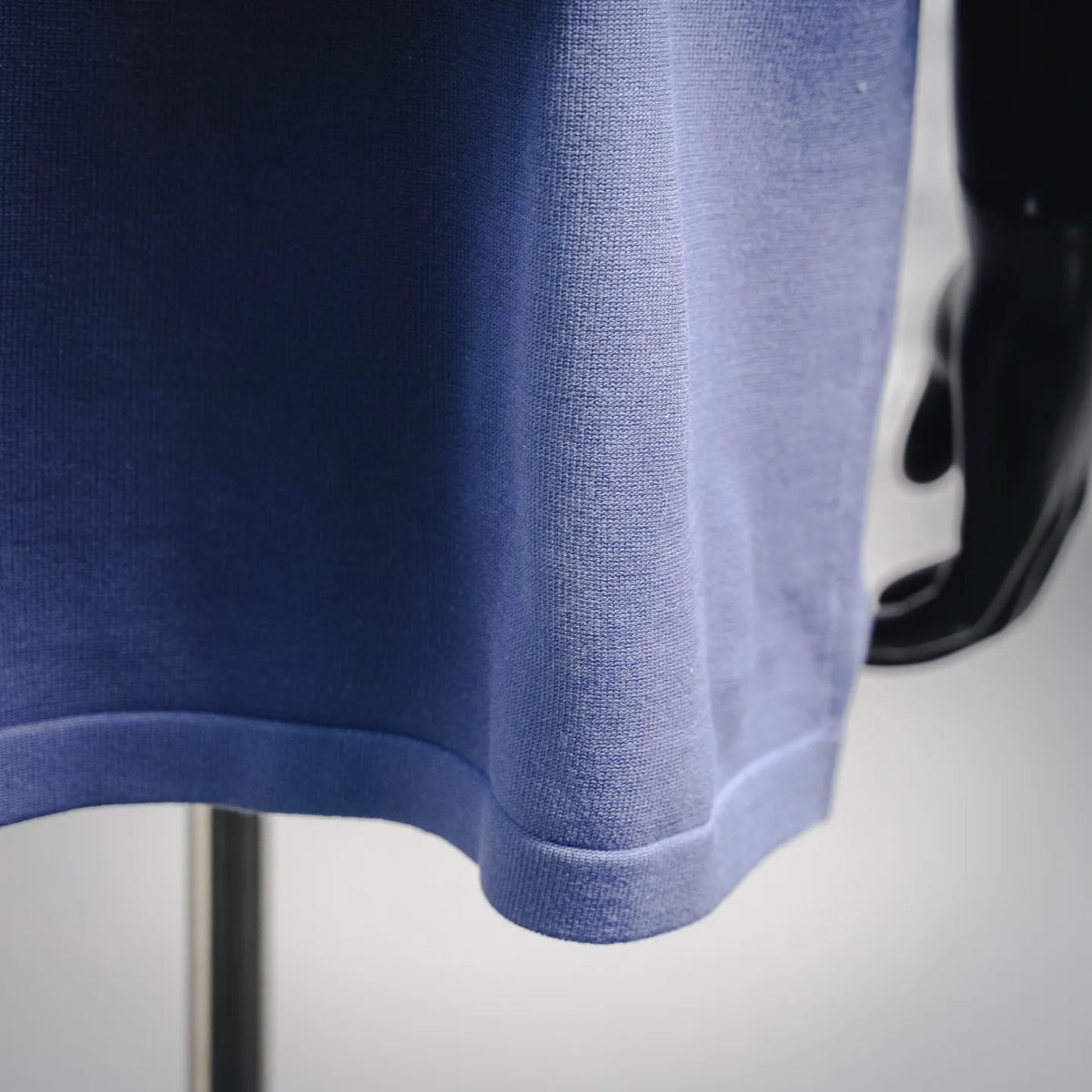Light purple T-shirt hem with ribbed trim at the sleeve cuff