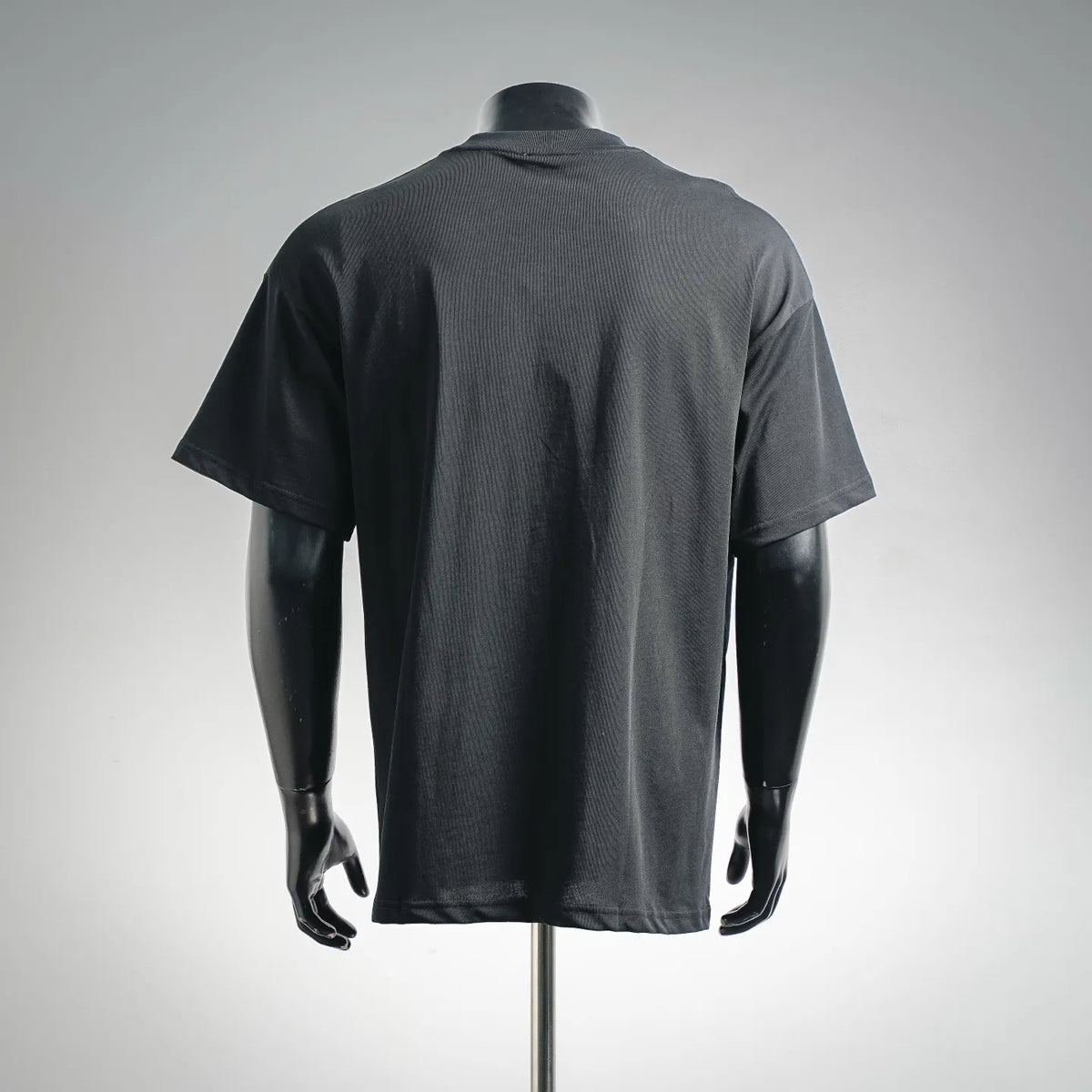 Black short-sleeve T-shirt on mannequin, back view