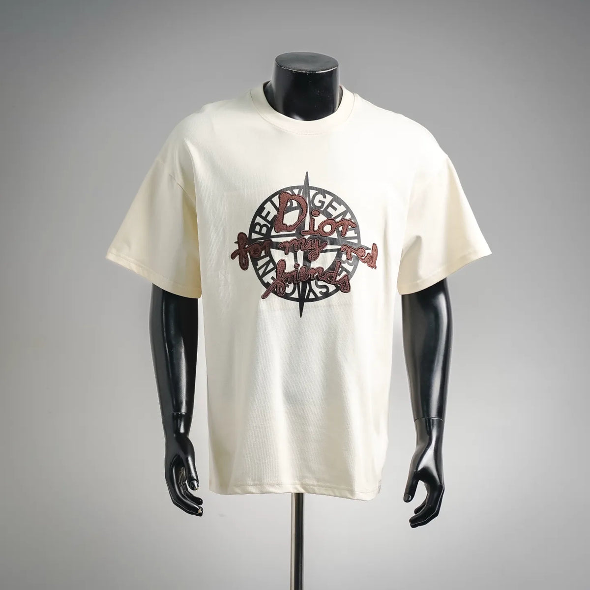 Cream Dior short-sleeve T-shirt with large circular logo graphic on front