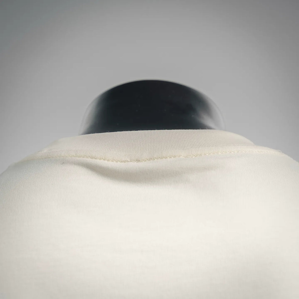 Cream crew neckline and collar seam on Dior T-shirt, plain back