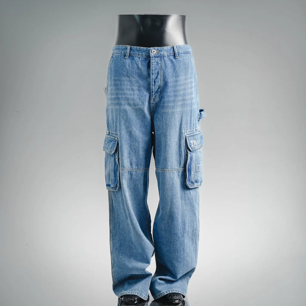 Light blue Dior cargo pants with multiple flap pockets and straight legs