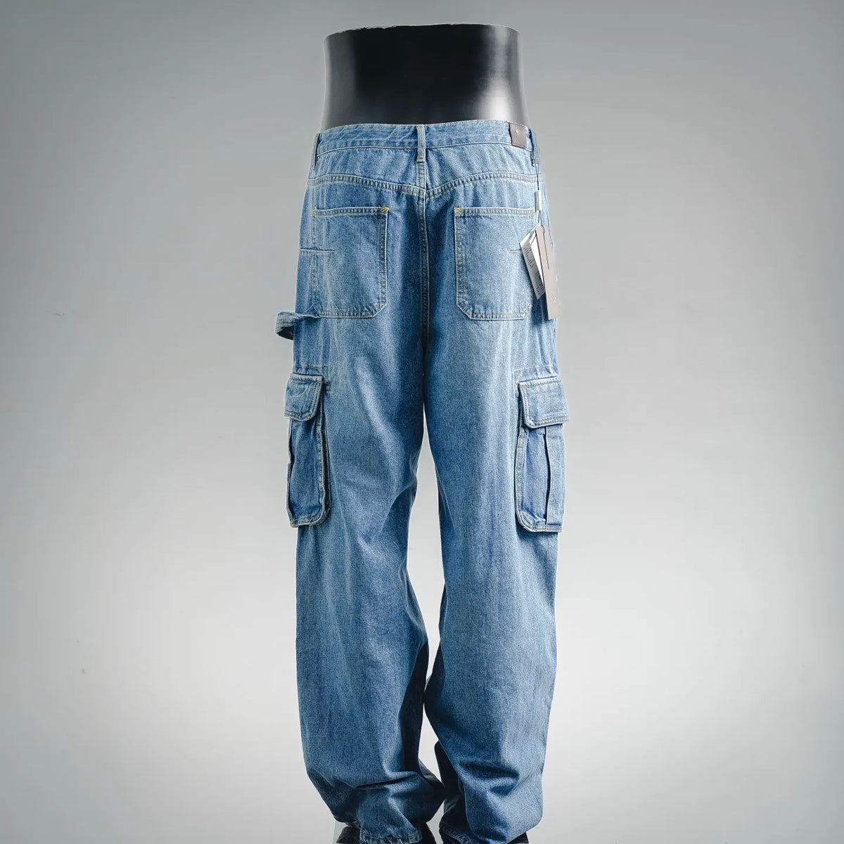 Light blue Dior cargo pants with side flap pockets and relaxed fit