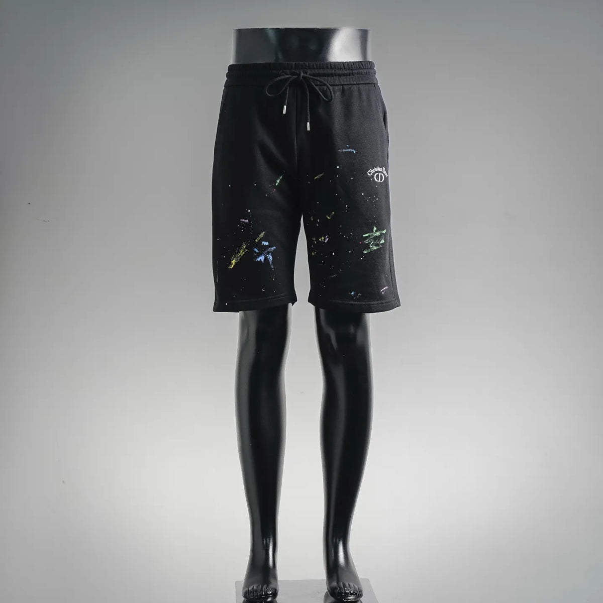 Black knee-length shorts with elastic waistband and drawstring