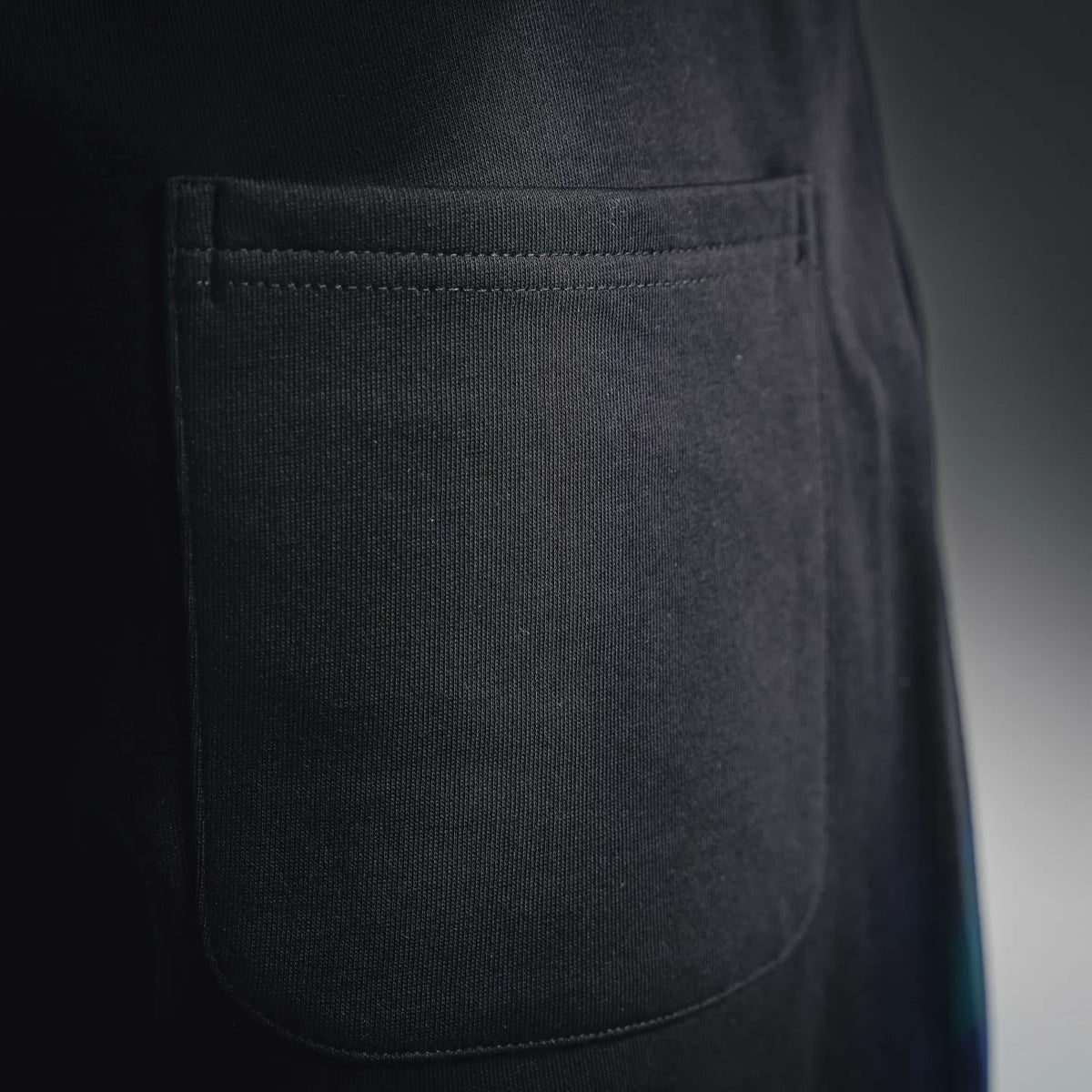 Black shorts front pocket panel with stitched seam detail